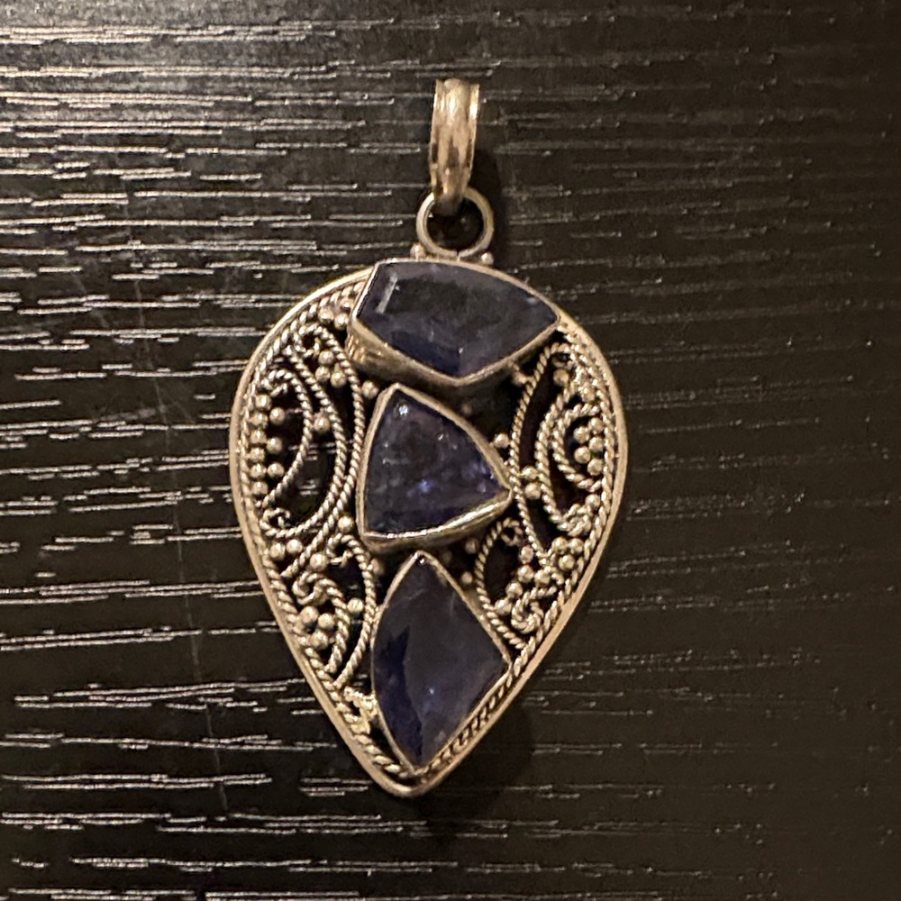 Vintage silver heart shaped charm with blue stones